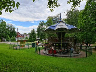 Fototapeta na wymiar Children's carousel in the park. Carousel rides.