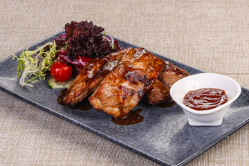 Grilled pork ribs with celery and carrot