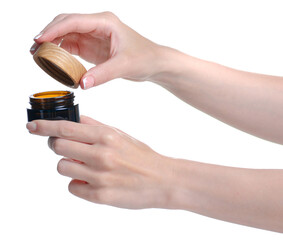 Bottle cream with wooden lid beauty in hand on white background isolation