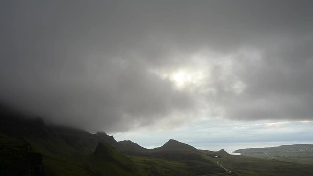 Dark clouds moving over the Quiraing, Isle of Skye, moody atmosphere. Time lapse.