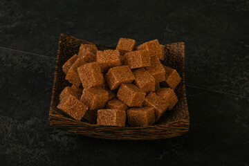 Cane sugar cubs in the bowl