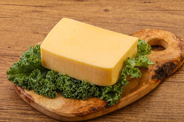 Tasty yelloow Tilsiter cheese brick