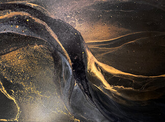 Abstract black art with gold — black background with beautiful smudges, stains and splashes made...
