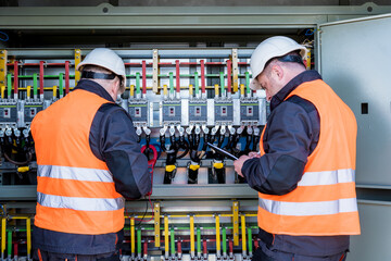 Checking the operating voltage levels of the solar panel switchgear compartment