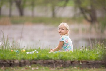 Little girl summer portrait in nature