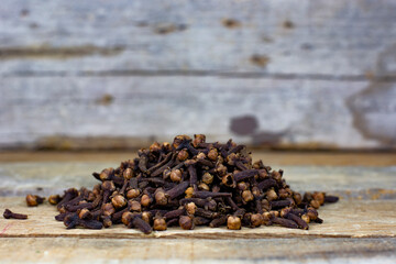 clove grains on wooden table