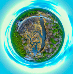 Panorama 360 degrees aerial view of green meadow and field near the road in the form of a small planet around which are gray and