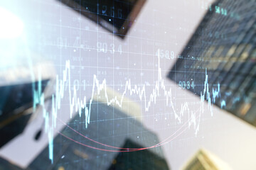 Multi exposure of abstract financial chart on office buildings background, research and analytics concept