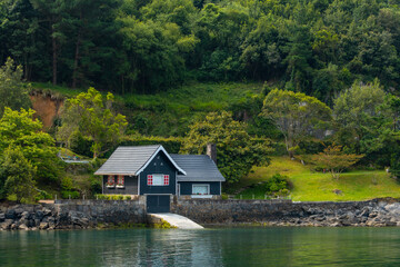 Fototapeta na wymiar A beautiful green house by the sea in Urdaibai, a Bizkaia biosphere reserve next to Mundaka. Basque Country