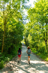 Obraz premium Two friends walking along the Urdaibai path, a Bizkaia biosphere reserve next to Mundaka. Basque Country