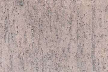 Abstract textured background. Close-up view of beige weathered concrete wall. Copy space for your text and decorations. Construction theme.