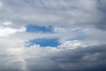 Fototapeta premium A glimpse of blue sky on a stormy day