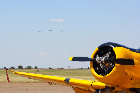 Yellow Aerobatic Aircraft With Formation On Approach, Pretoria, South Africa