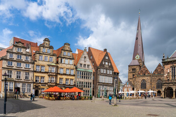 colorful old guild houses on the market square in the historic old city center of Bremen with the Church Our Lady behind