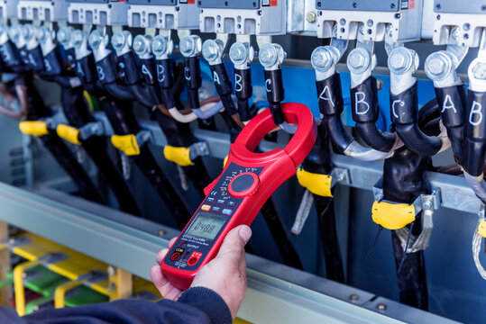 Checking the operating voltage levels of the solar panel switchgear compartment