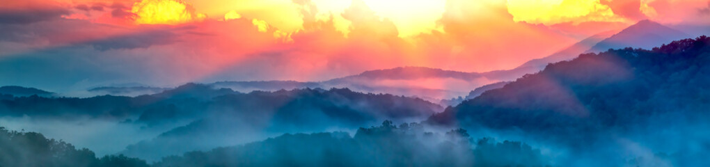 Panoramic View Of Smoky Mountain Ridges With Fog And Light-rays