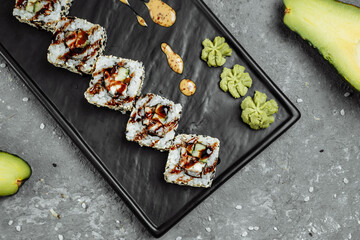 California Roll sushi with smoked eel, cucumber, avocado. Sushi menu. Japanese food
