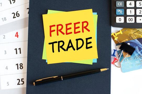 freer trade - text on yellow paper on blue background, concept