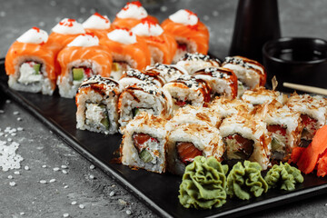 Sushi set with fresh ingredients on gray background. Sushi menu. Japanese food