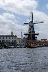 Fototapeta na wymiar vertical view of the Dee Adrian Windmill in Haarlem
