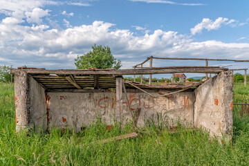 Demolished bench for reserve football players. Abandoned soccer field.