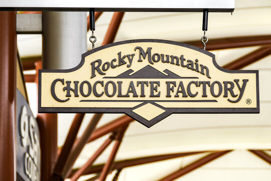 Seattle, Washington State, USA - June 2018: Close Up View Of A Sign Outside The Rocky Mountain Chocolate Factory Store At The Premium Outlets Shopping Mall In Tulalip Near Seattle.