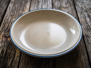 Empty plate on wooden table
