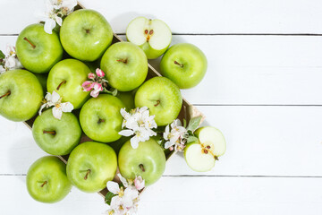 Apples fruits green apple fruit box on wooden board copyspace copy space with leaves and blossoms