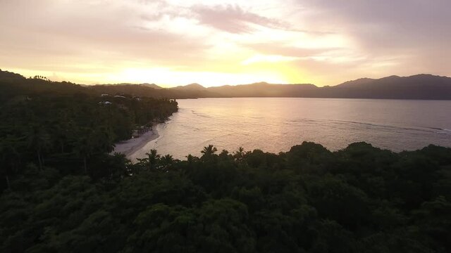Breathtaking sunset at Las Galeras, Samana in Dominican Republic. Aerial forward