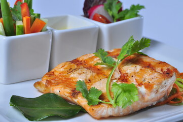 Baked salmon with with vegetables and sauce