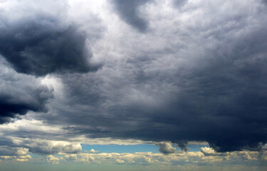 Beautiful contrasting large clouds in blue sky for background