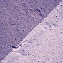 Wall with a texture of plaster, painted in two colors. Blue and violet on a dioganal.Blue and purple. Beautiful background.