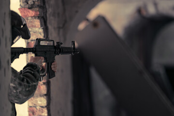 Fototapeta premium soldier training while playing paintball in the fortress