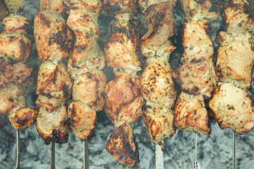 Meat skewers on grill as background, closeup. Outdoor kitchen