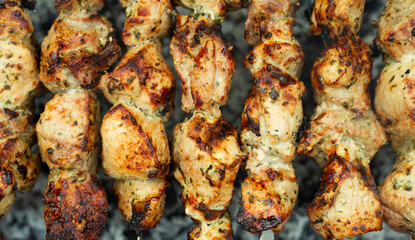 Meat skewers on grill as background, closeup. Outdoor kitchen