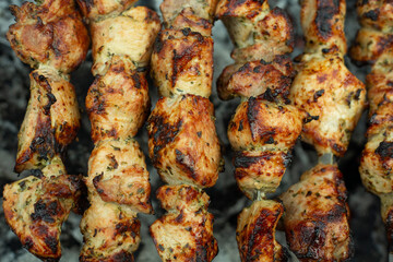 Meat skewers on grill as background, closeup. Outdoor kitchen