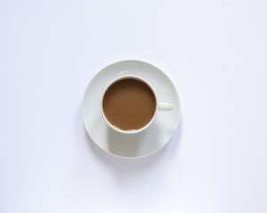 white cup with coffee on white