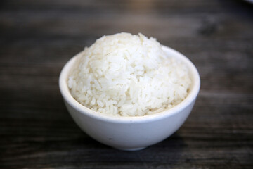 White steamed rice in a dish. Chinese Steamed Wite Rice in a white bowl. Chinese Lunch. White Rice.