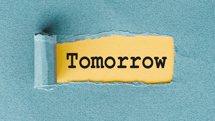 TOMORROW - words written under ripped and torn paper.