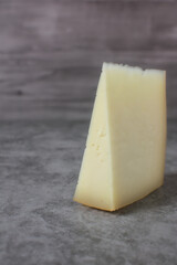 Wedge of idiazabal cheese on stone