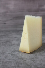 Wedge of idiazabal cheese on stone