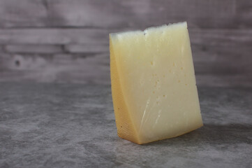 Wedge of idiazabal cheese on stone