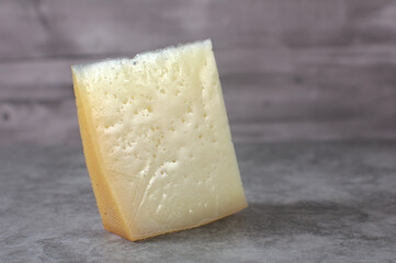 Wedge of idiazabal cheese on stone