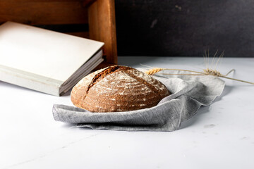 Round Gluten-free Buckwheat Bread with a crispy brown crust. Selective focus.
