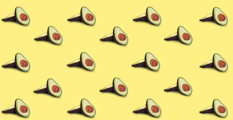 cut in half avocado on a yellow background. layout. food background