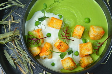 Broccoli cream soup and ingredients on table
