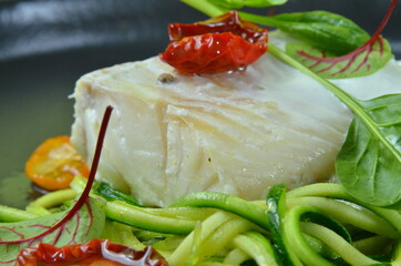 Salmon filet with vegetables on rustik background