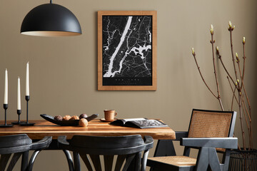 Stylish dining room interior with mock up poster map, wooden walnut table, design chairs, cup of...