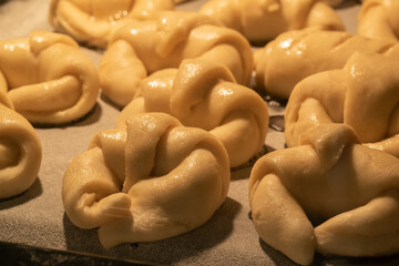 Argentine Croissants (medialunas) pastry cooking with caramel in the oven