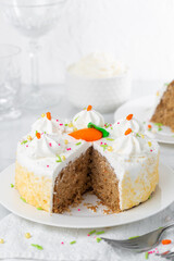Carrot cake with icing and sprinkles at an Easter party